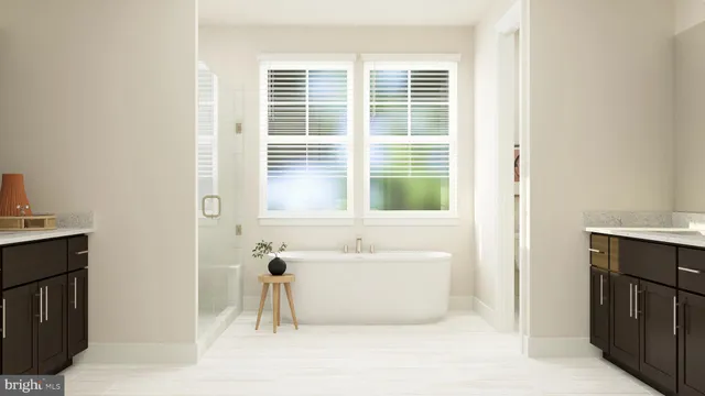 a bathroom with a bathtub and a window