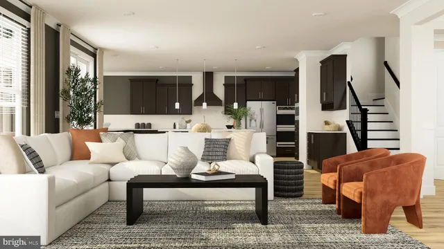 a living room with furniture a rug and a large window