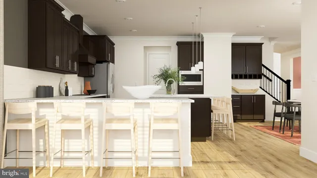 a kitchen with stainless steel appliances kitchen island granite countertop a refrigerator and a sink