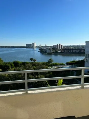 a view of a swimming pool with a terrace