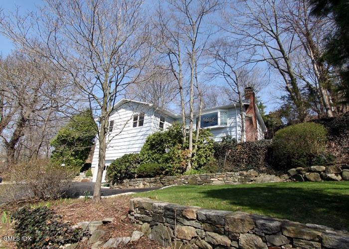211 Sheep Hill Road Riverside, CT 06878 - Photo 1 of 9 a front view of a house with garden