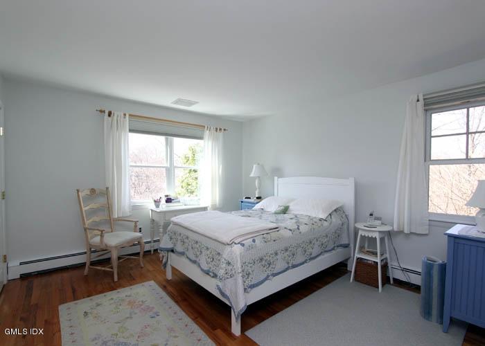 211 Sheep Hill Road Riverside, CT 06878 - Photo 5 of 9 a bedroom with a bed and a window
