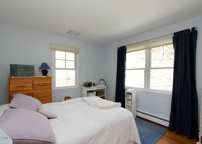 211 Sheep Hill Road Riverside, CT 06878 - Photo 6 of 9 a bedroom with a bed and window