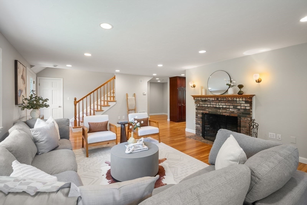 49 Walpole Street Dover, MA 02030 - Photo 14 of 40 a living room with furniture and a fireplace