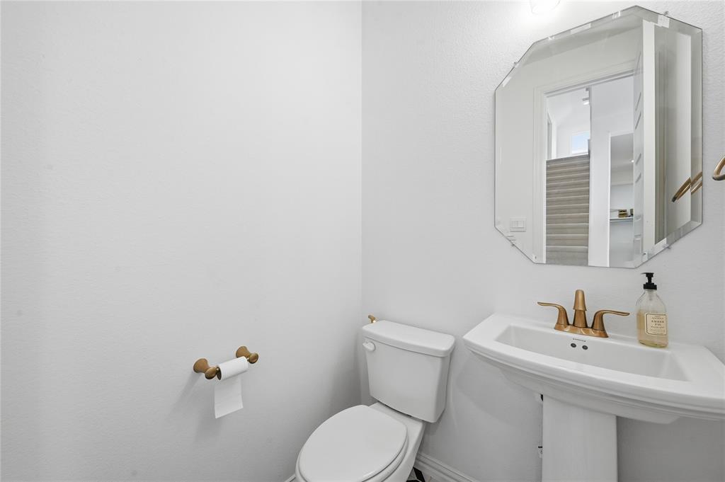 2188 Cloverfern Way Haslet, TX 76052 - Photo 12 of 30 a bathroom with a sink mirror and toilet