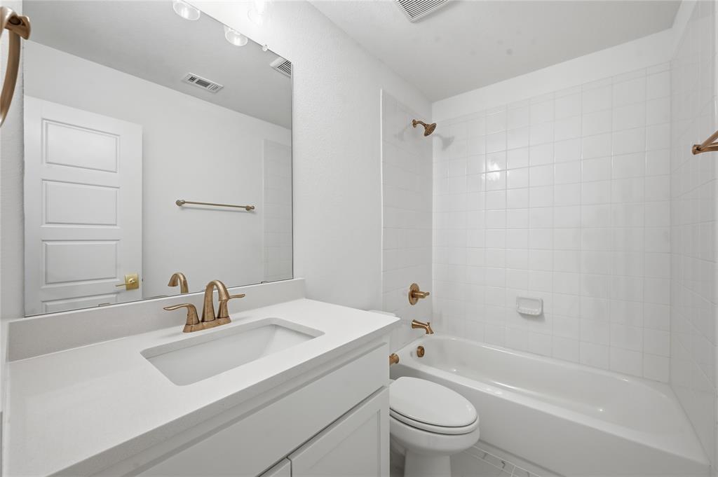 2188 Cloverfern Way Haslet, TX 76052 - Photo 17 of 30 a bathroom with a sink toilet tub and shower