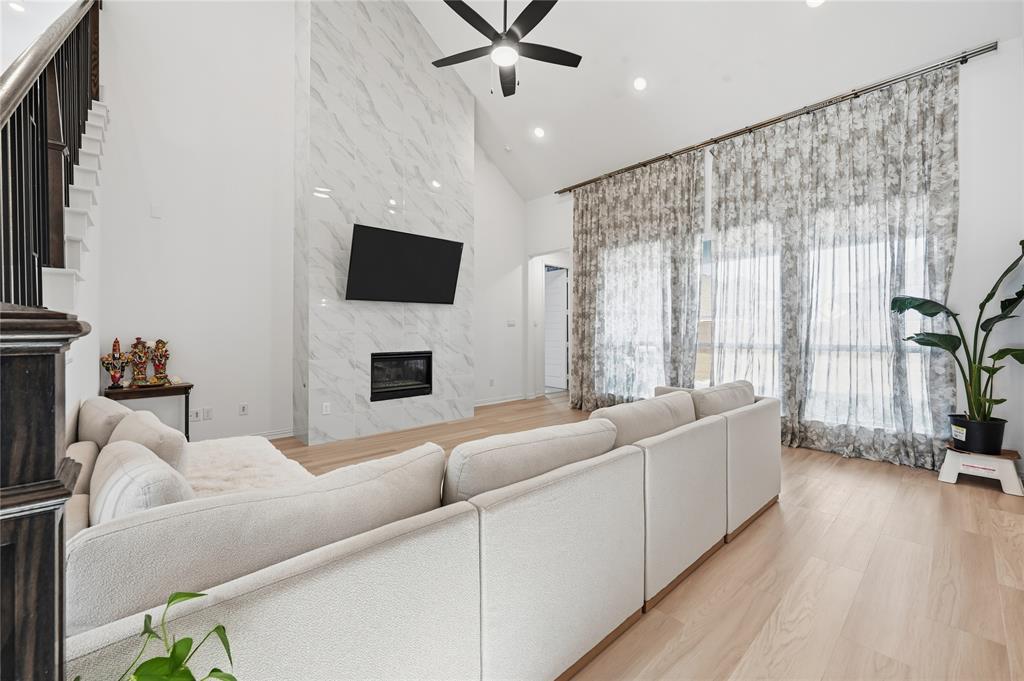 2188 Cloverfern Way Haslet, TX 76052 - Photo 4 of 30 a living room with furniture and a flat screen tv