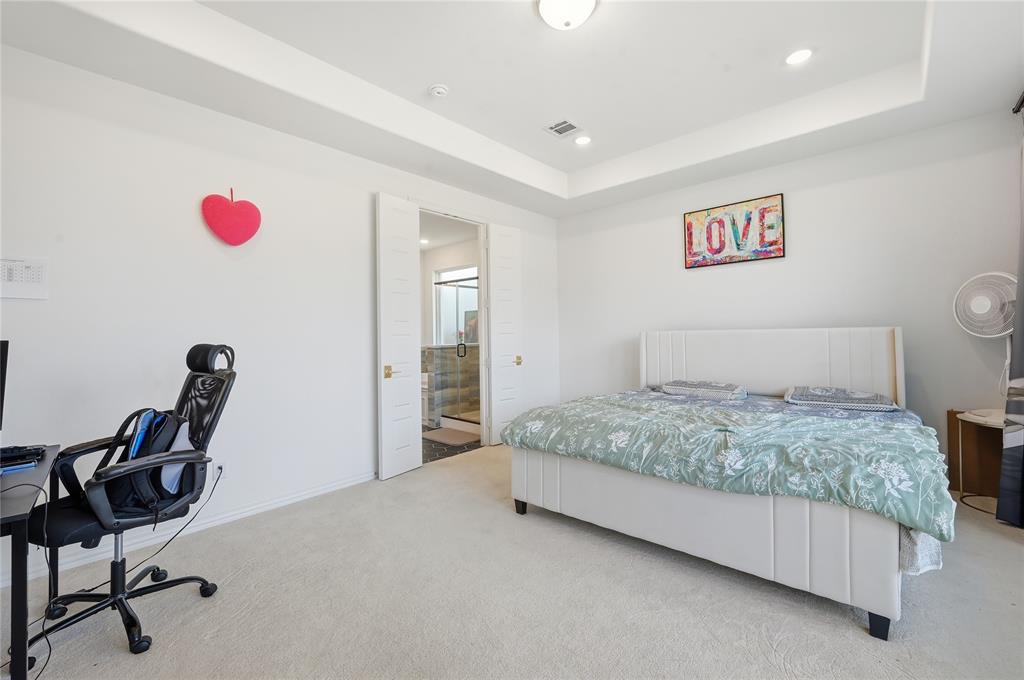 2188 Cloverfern Way Haslet, TX 76052 - Photo 9 of 30 a bedroom with a bed and furniture