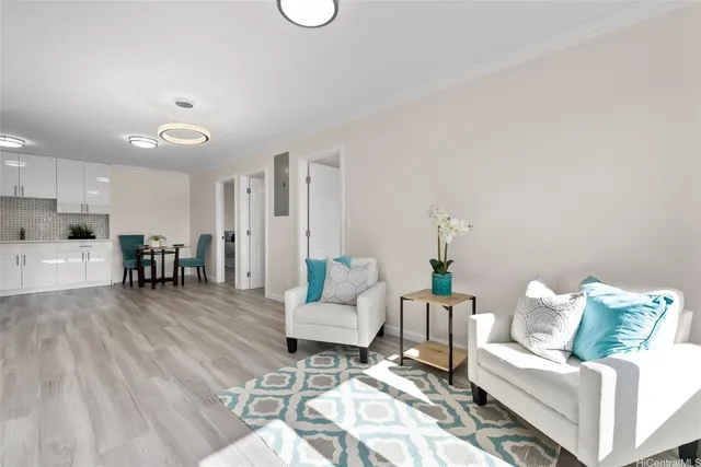 a living room with furniture and wooden floor