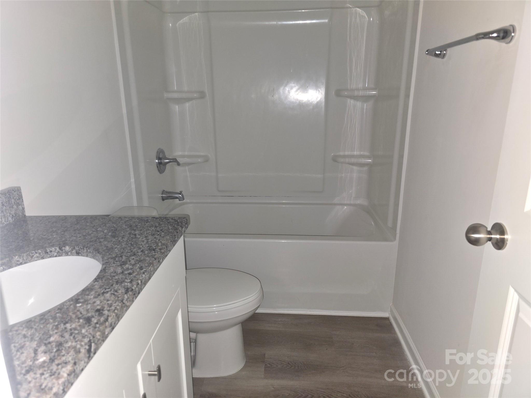 103 Spring Drive Salisbury, NC 28144 - Photo 12 of 21 a bathroom with a granite countertop sink toilet and shower