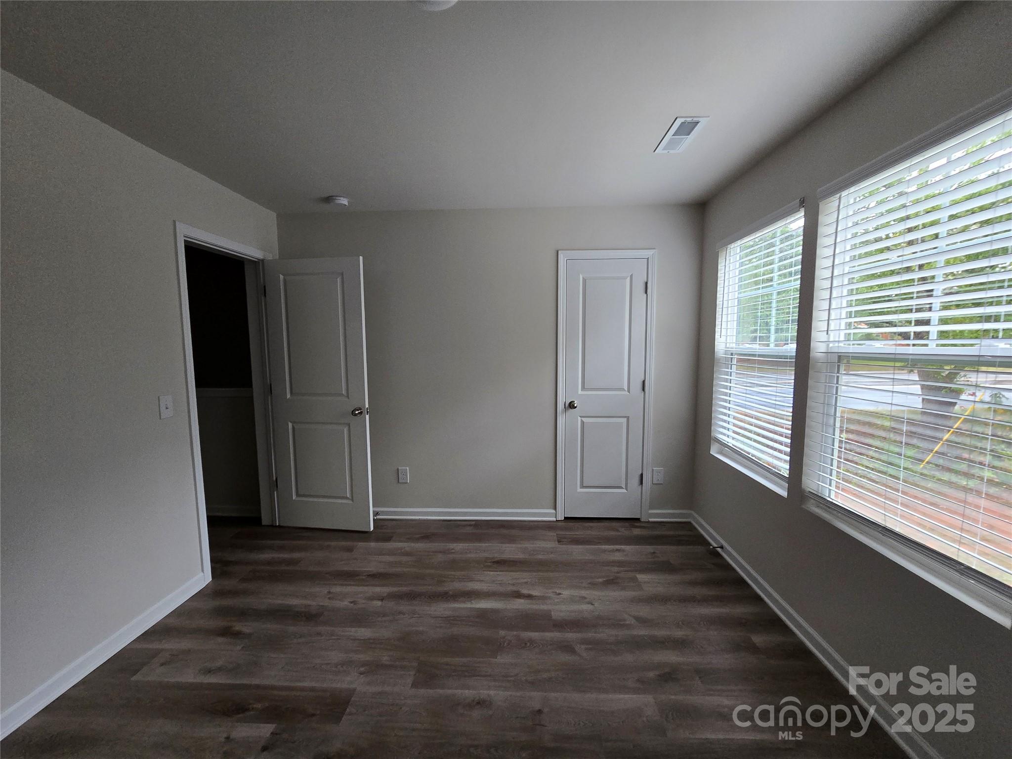 103 Spring Drive Salisbury, NC 28144 - Photo 14 of 21 a view of an empty room with wooden floor and a window