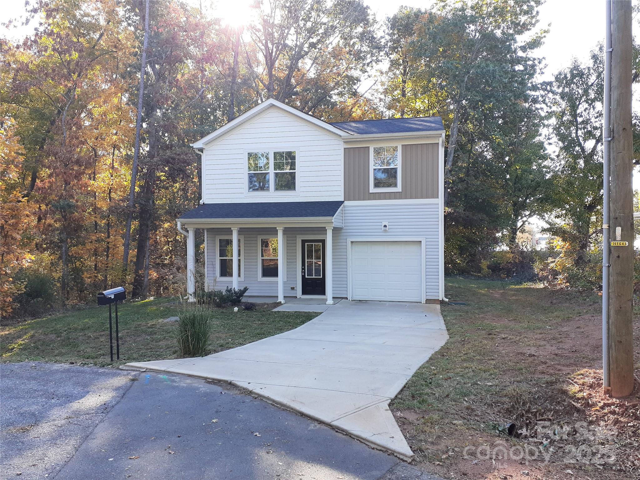 103 Spring Drive Salisbury, NC 28144 - Photo 19 of 21 a front view of a house with a yard and garage