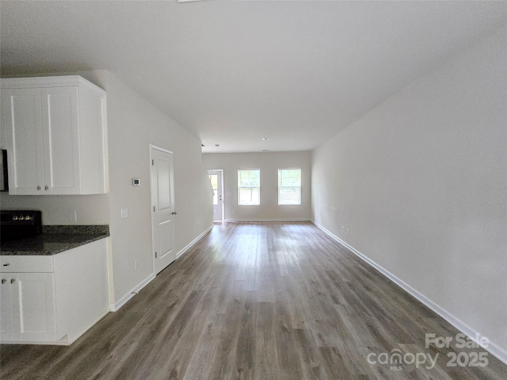 103 Spring Drive Salisbury, NC 28144 - Photo 2 of 21 a view of hallway with wooden floor and window