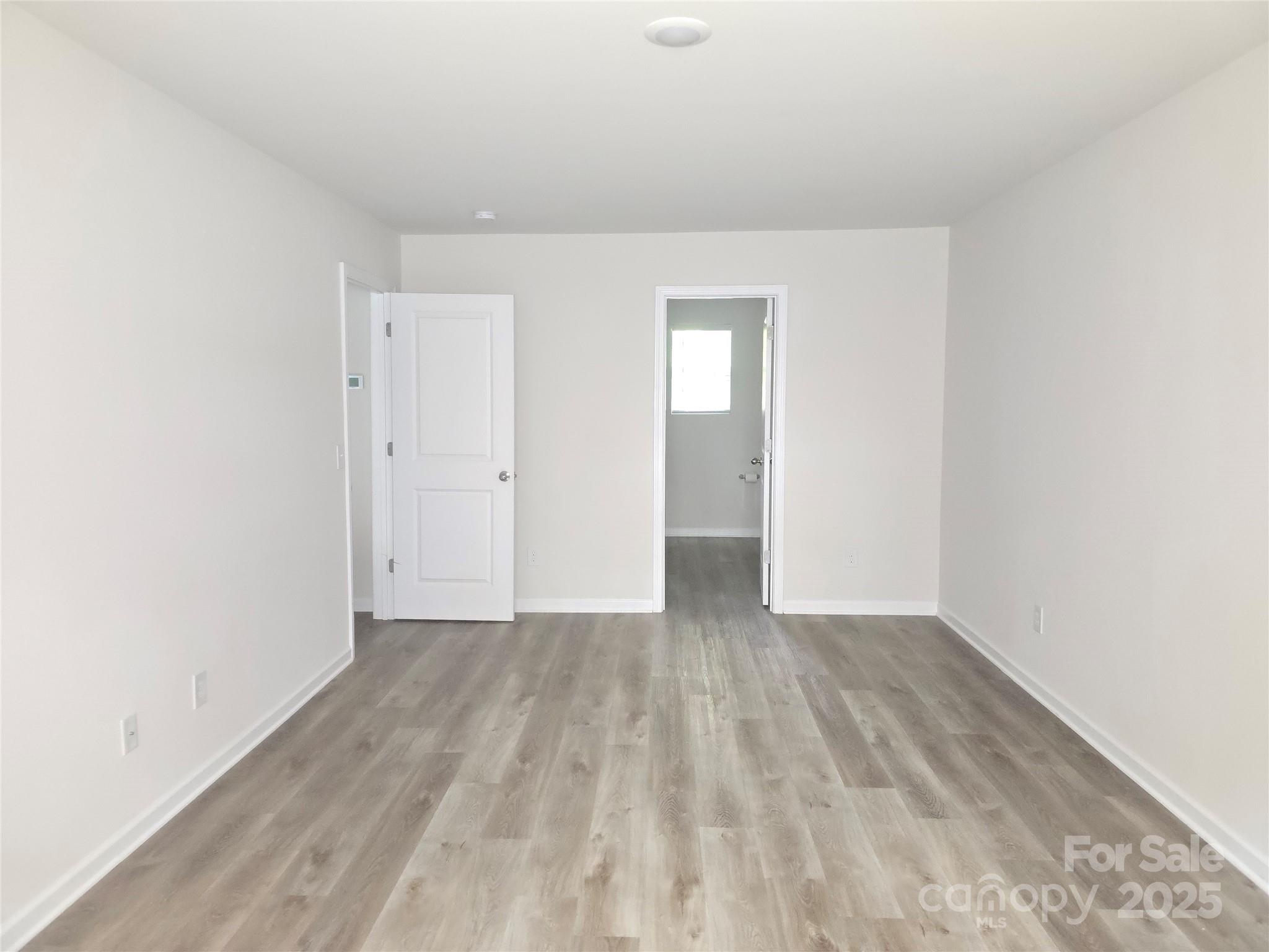 103 Spring Drive Salisbury, NC 28144 - Photo 8 of 21 a view of an empty room and wooden floor