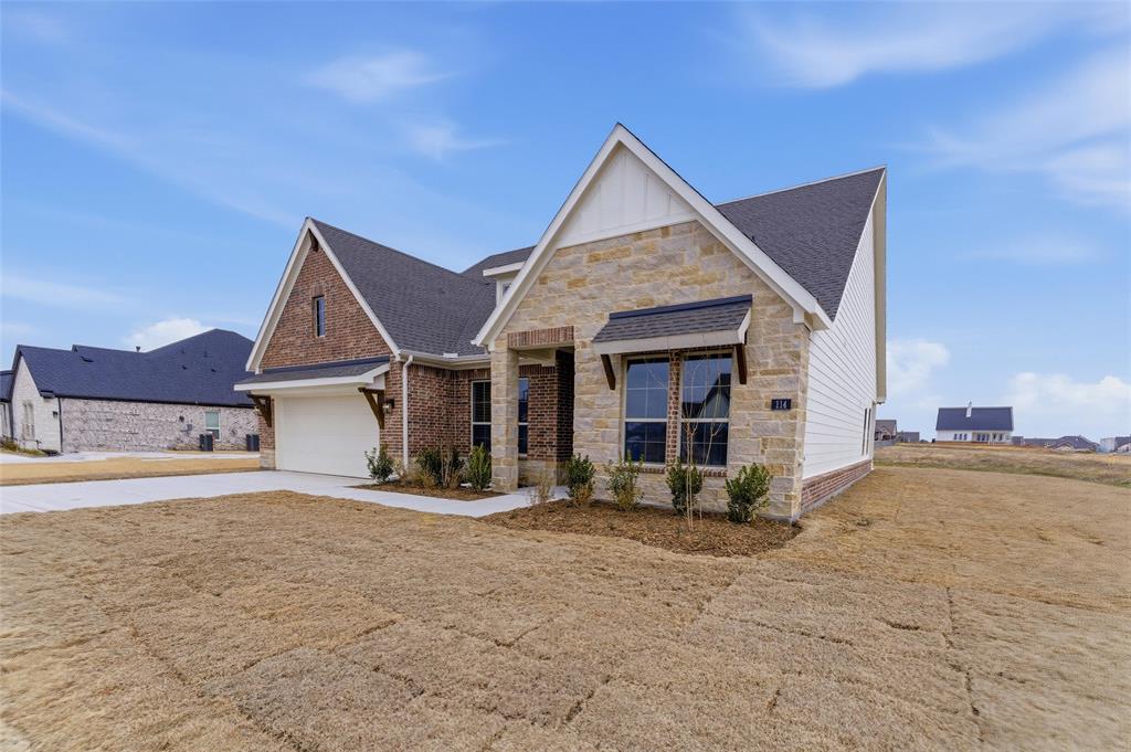 114 Brandywine Trail Rhome, TX 76078 - Photo 4 of 27 a view of a house with wooden fence
