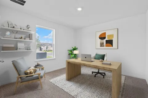 a workspace with furniture and window