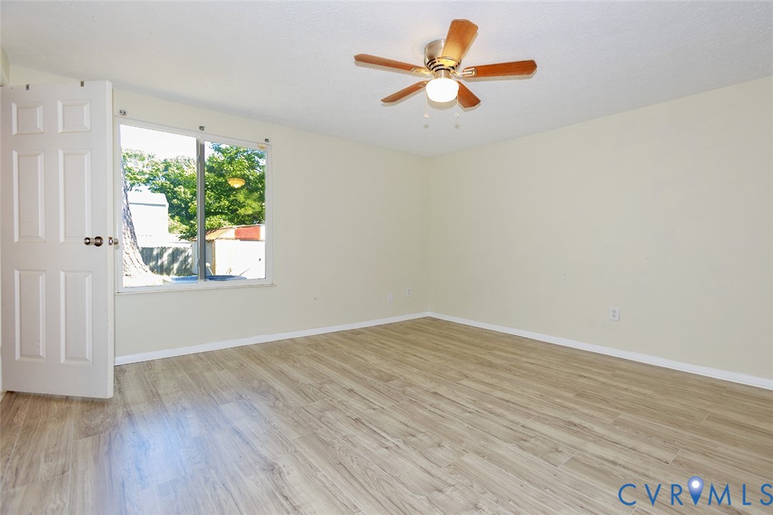 925 Fluvanna Road Newport News, VA 23601 - Photo 13 of 25 an empty room with a window and a ceiling fan