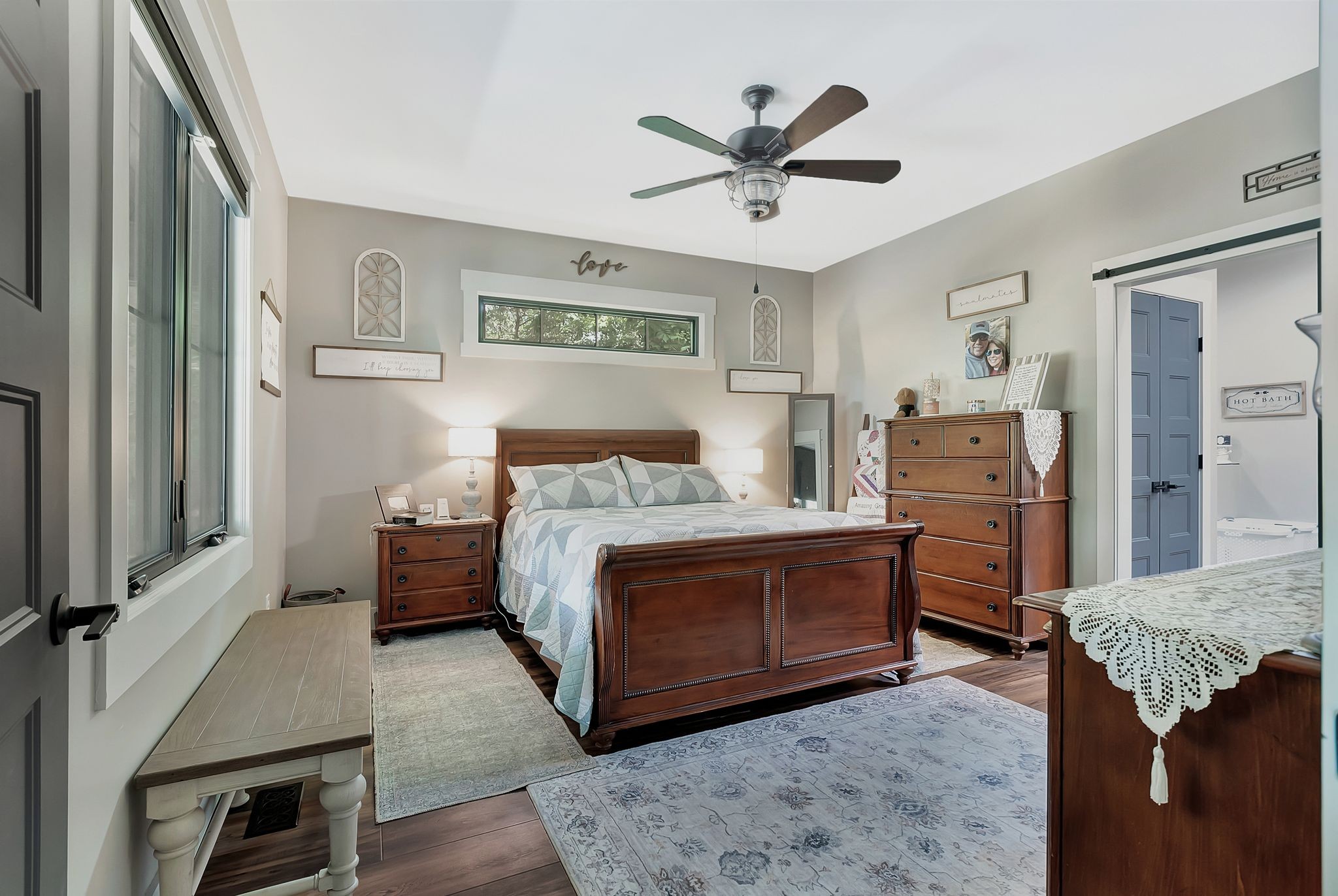 704 Beasleys Bend Road Lebanon, TN 37087 - Photo 23 of 35 a bedroom with a bed and a chandelier
