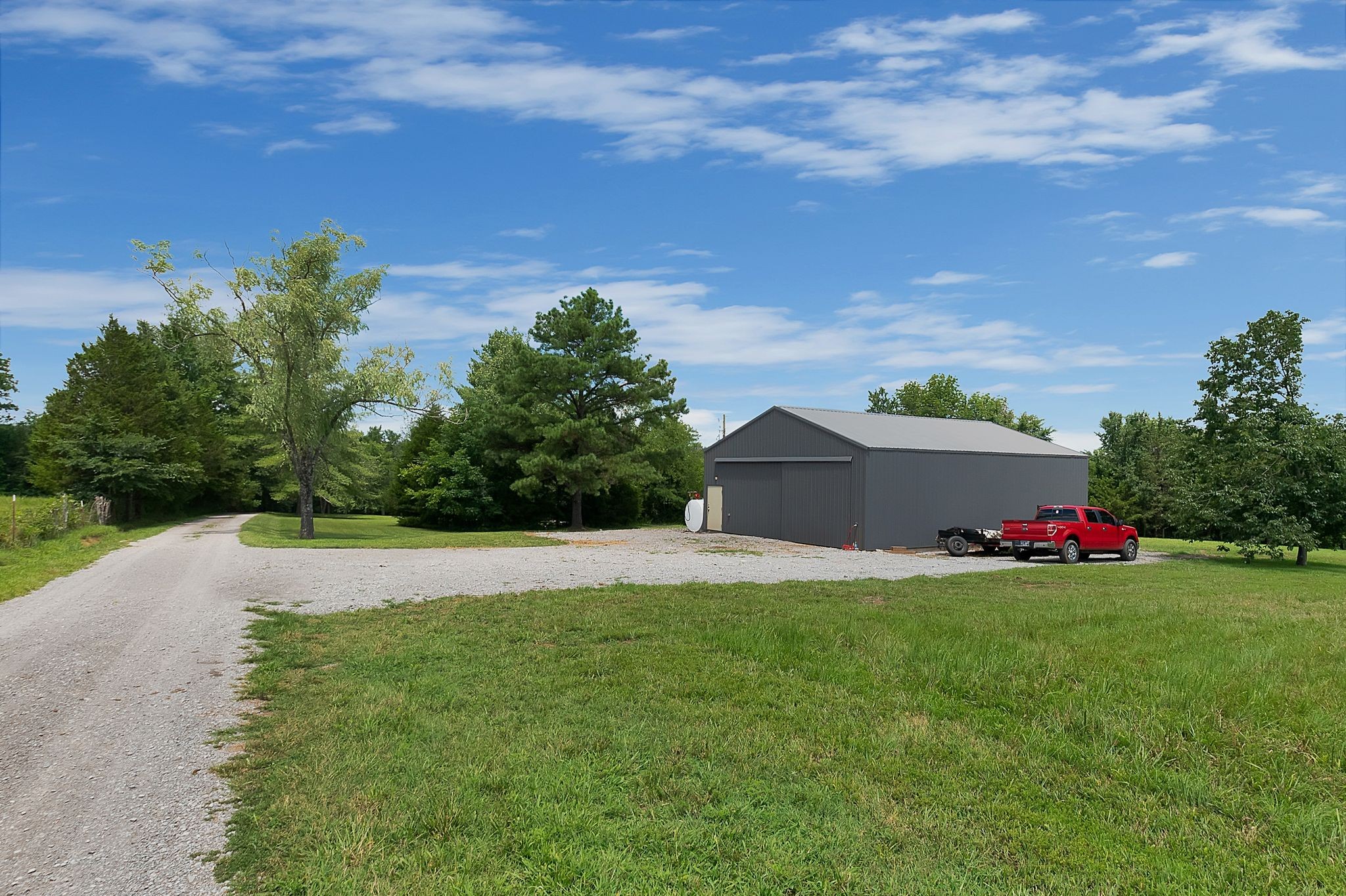704 Beasleys Bend Road Lebanon, TN 37087 - Photo 35 of 35 a view of a backyard and basketball court