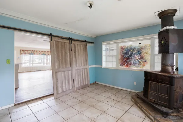 a view of an empty room with a window