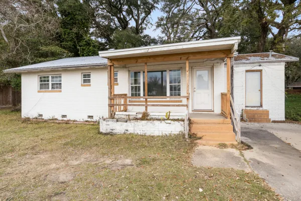 a front view of a house with yard