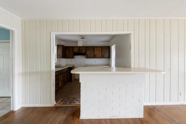 a kitchen with a sink and a stove top oven