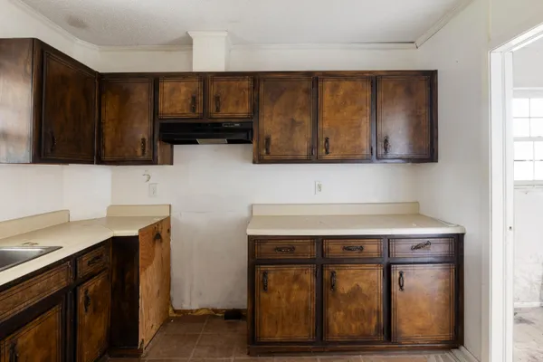 a kitchen with stainless steel appliances granite countertop a stove and a microwave