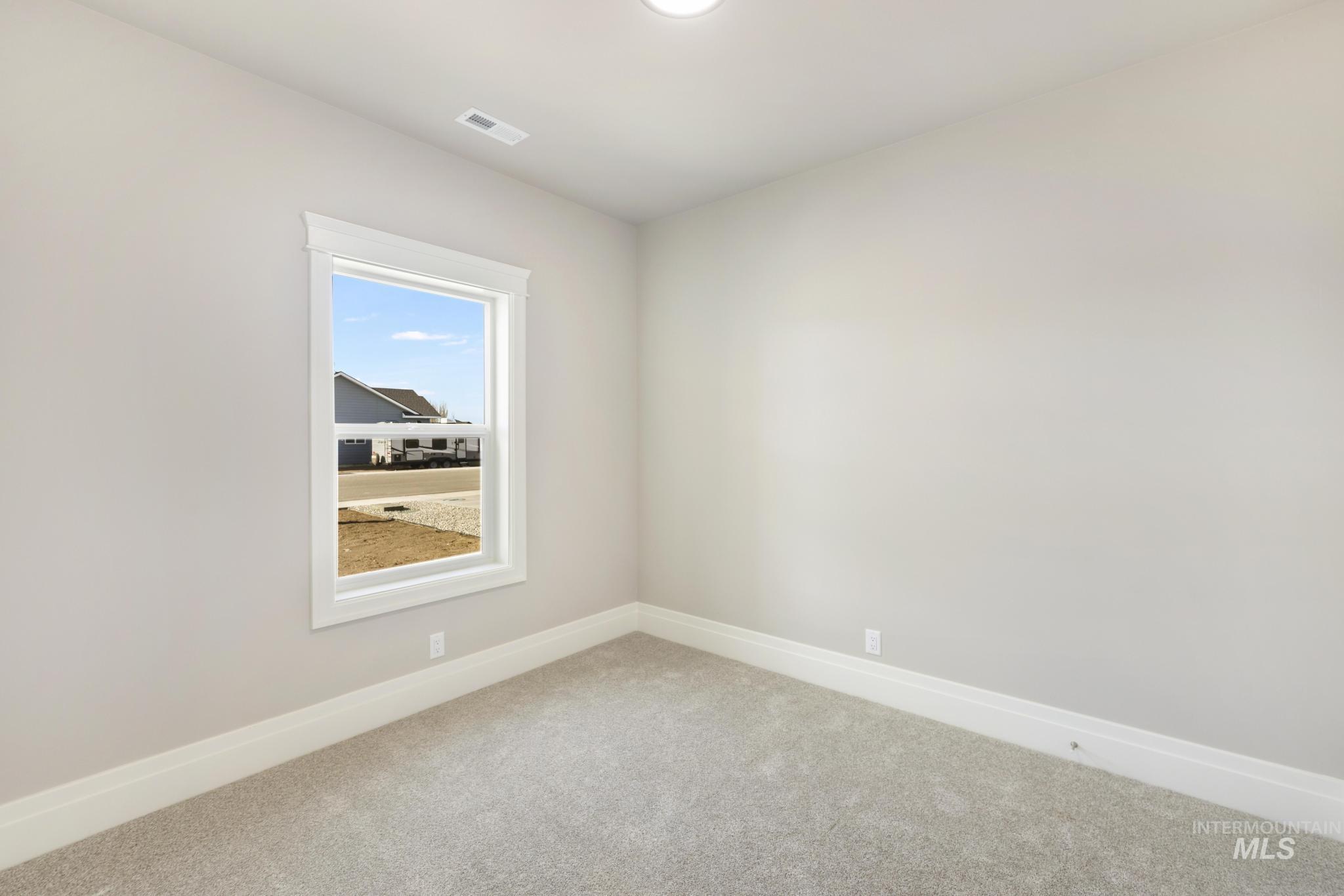 1316 K Street Rupert, ID 83350 - Photo 20 of 44 Spare room with baseboards and carpet