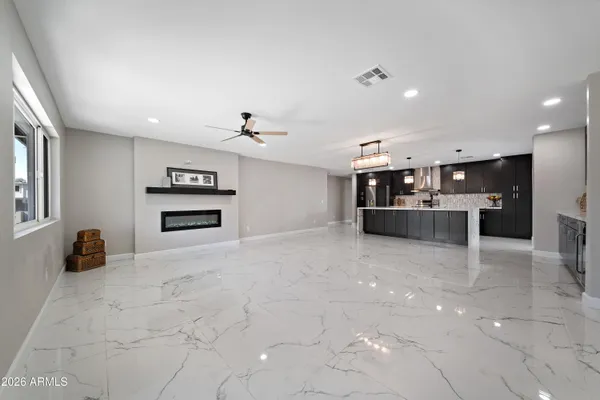 a kitchen with stainless steel appliances a stove and more cabinets