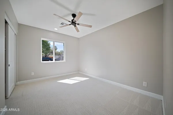 a view of an empty room with a window