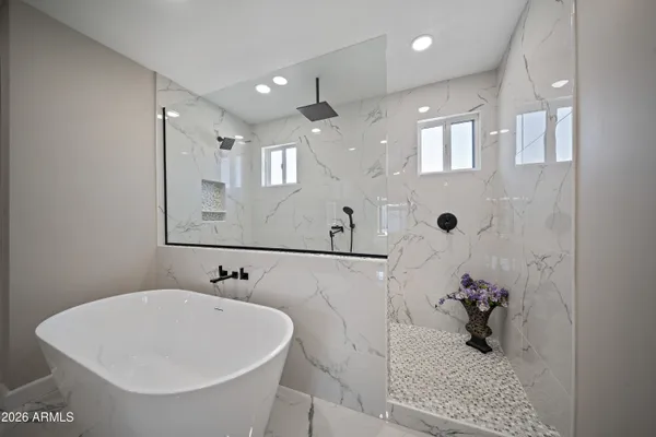 a bathroom with a sink and mirror