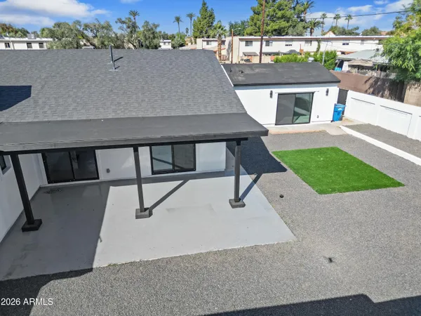 an aerial view of a house with a yard and garage
