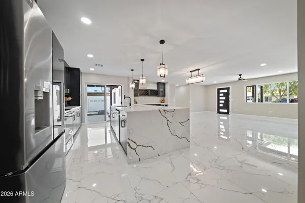 a view of a kitchen and dining area