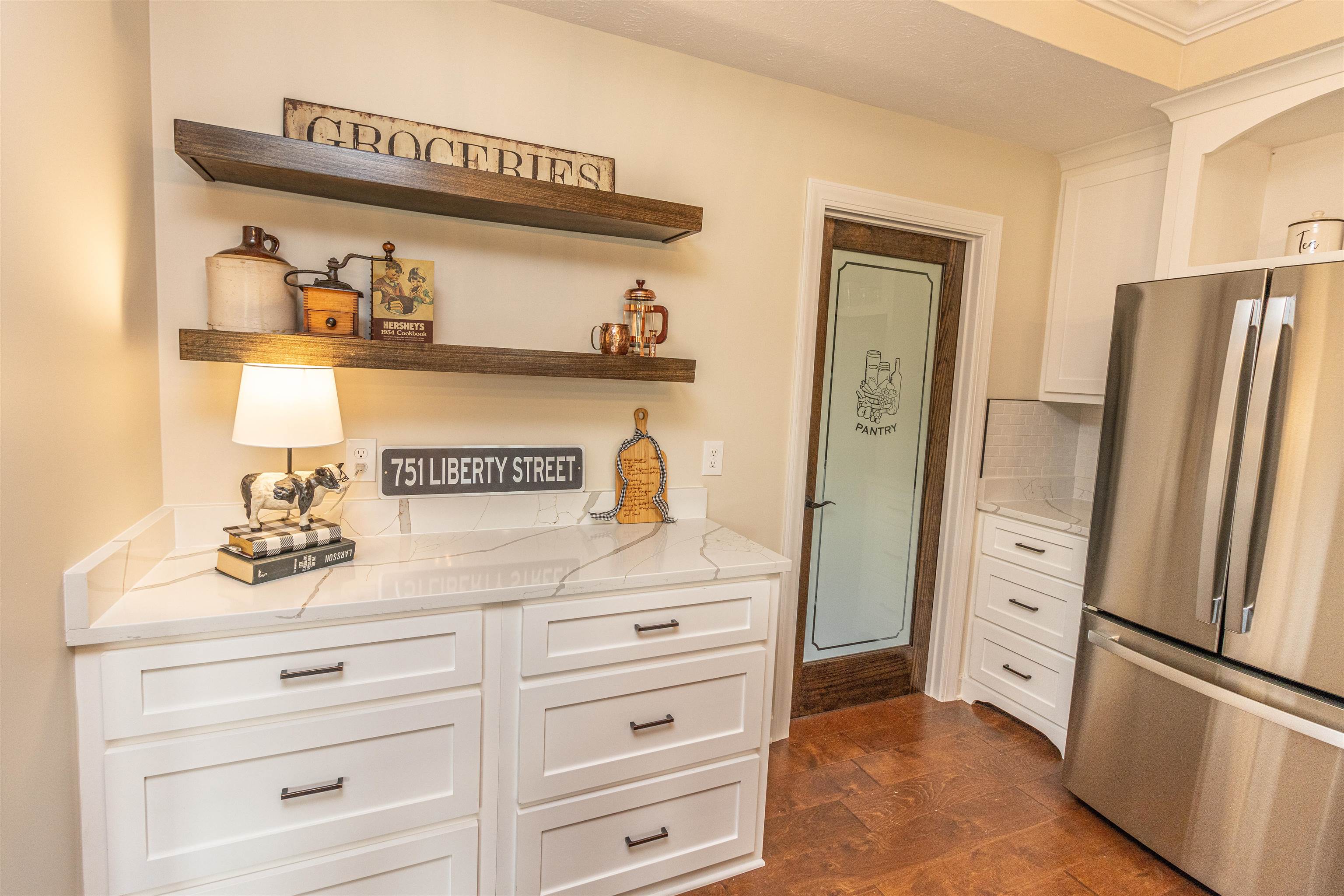 150 Windchase Cove Adamsville, TN 38310 - Photo 12 of 21 a kitchen with stainless steel appliances a refrigerator and cabinets