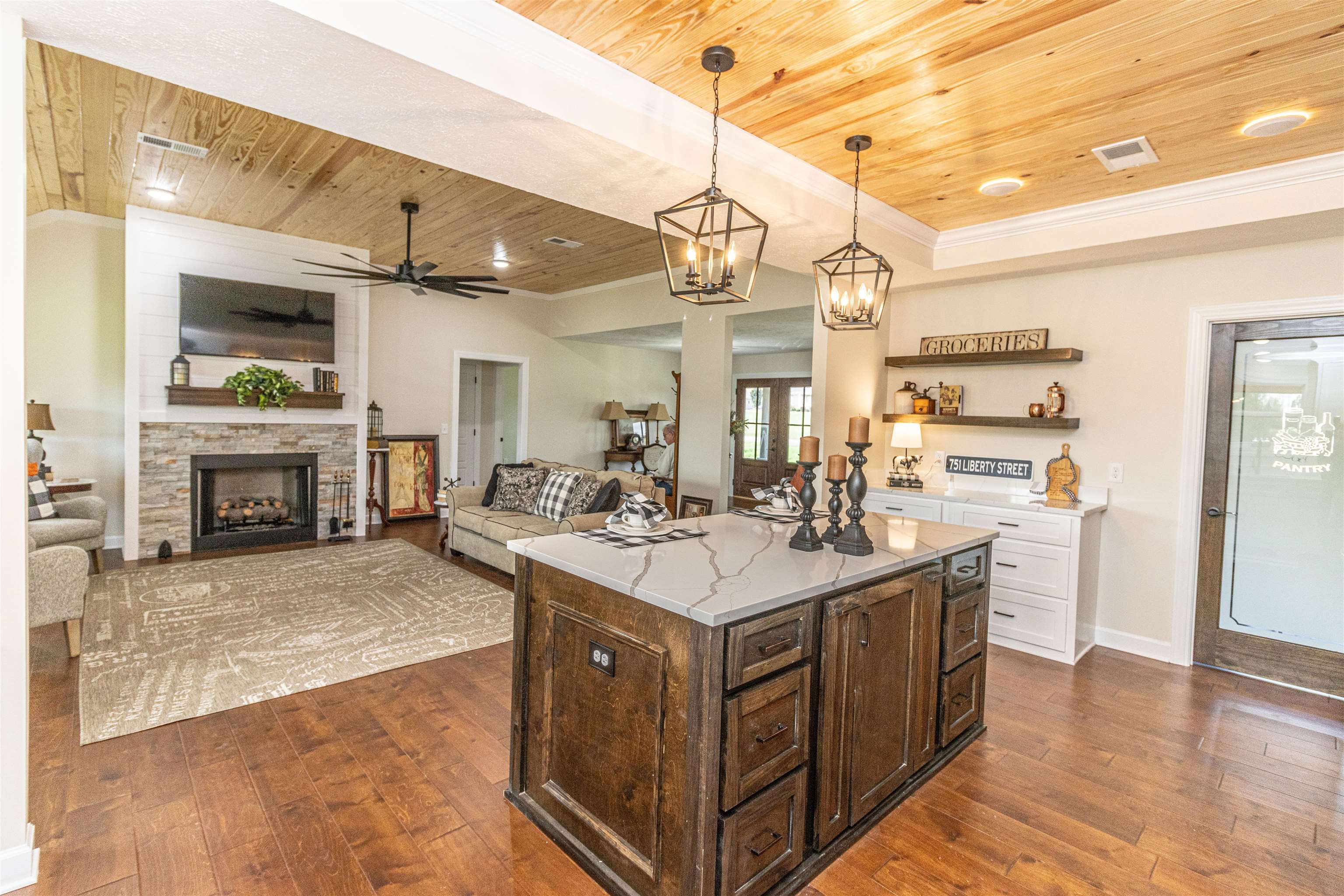 150 Windchase Cove Adamsville, TN 38310 - Photo 14 of 21 Kitchen featuring wood ceiling, dark hardwood / wood-style flooring, a kitchen island, and pendant lighting