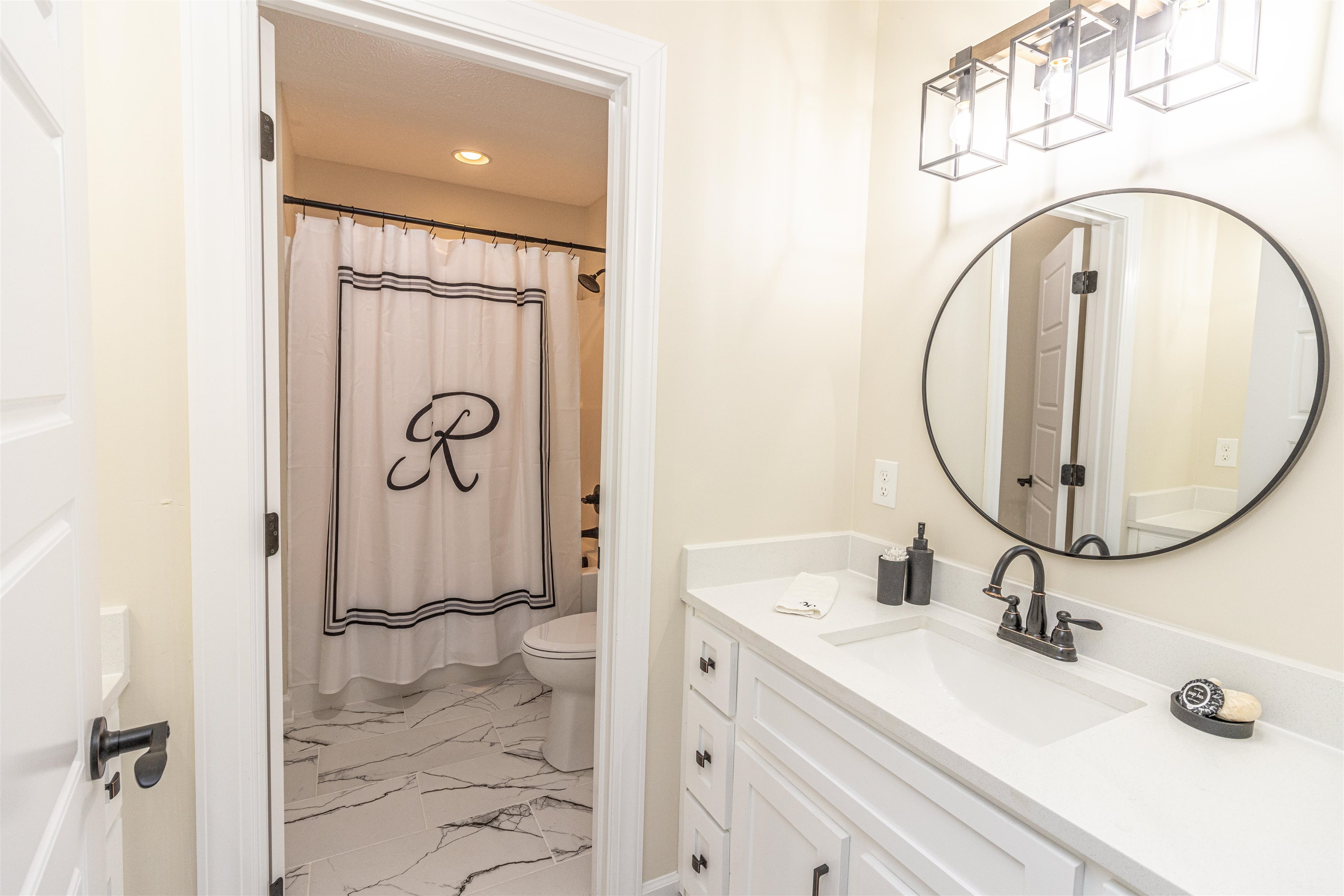 150 Windchase Cove Adamsville, TN 38310 - Photo 16 of 21 a bathroom with a sink and a mirror