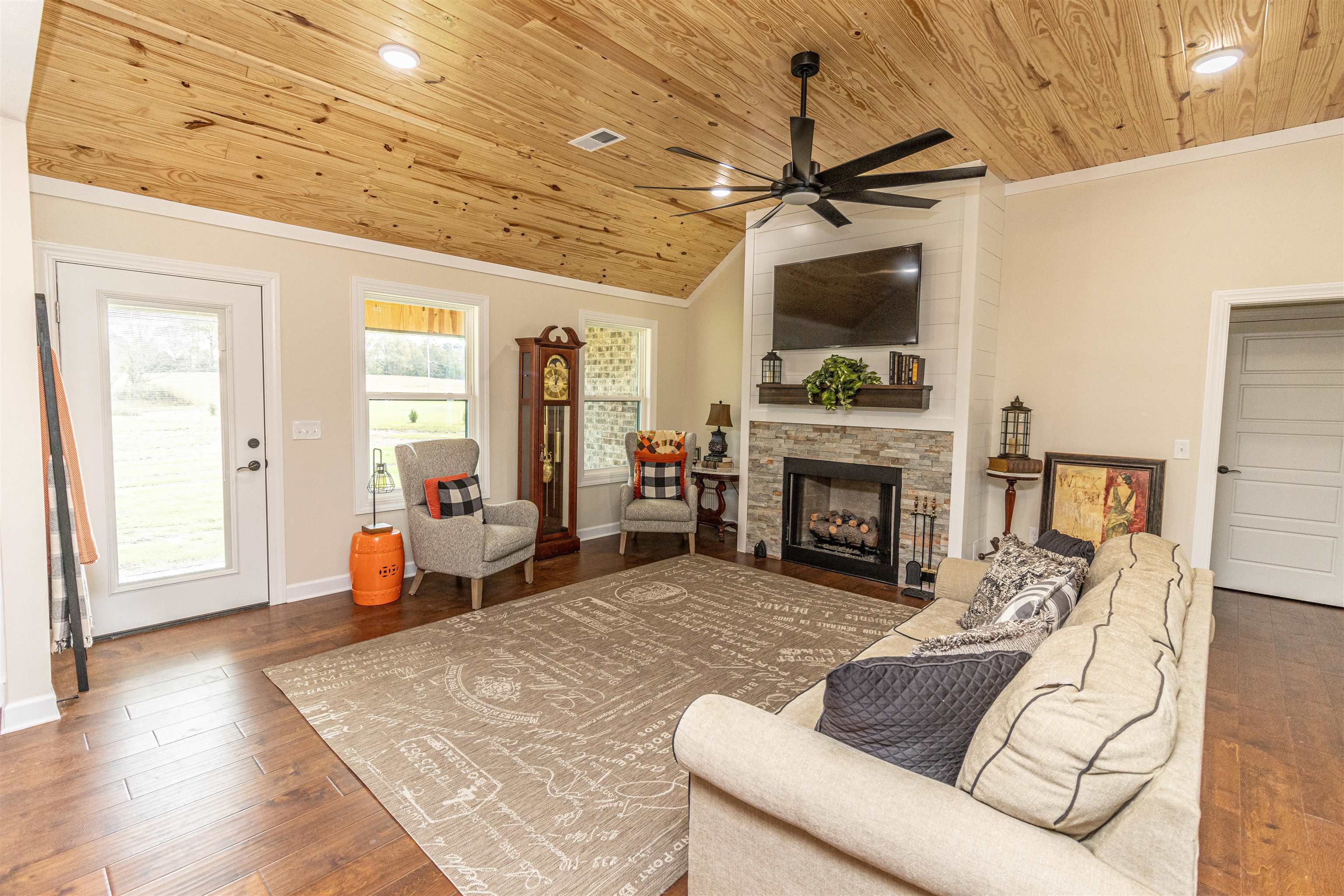 150 Windchase Cove Adamsville, TN 38310 - Photo 5 of 21 a living room with furniture and a fireplace