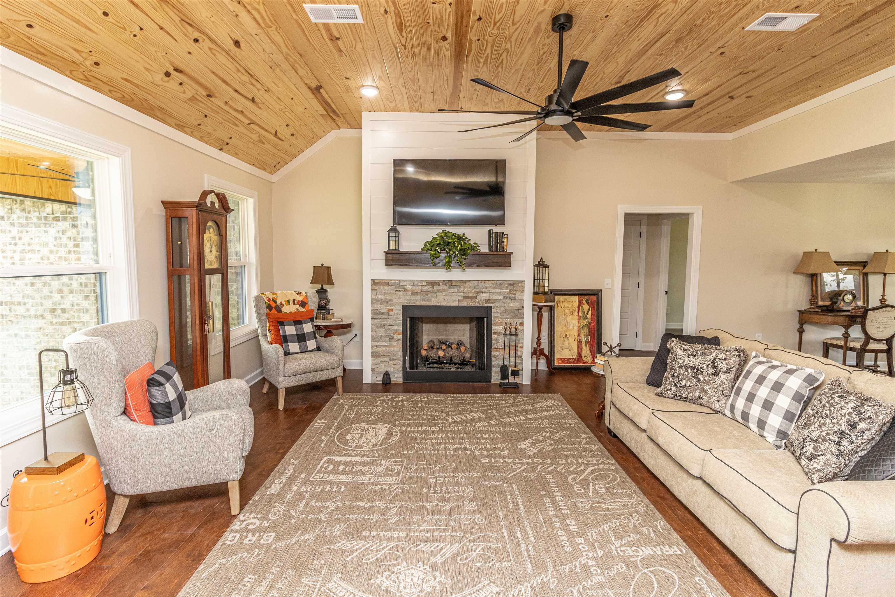 150 Windchase Cove Adamsville, TN 38310 - Photo 6 of 21 a living room with furniture and a fireplace