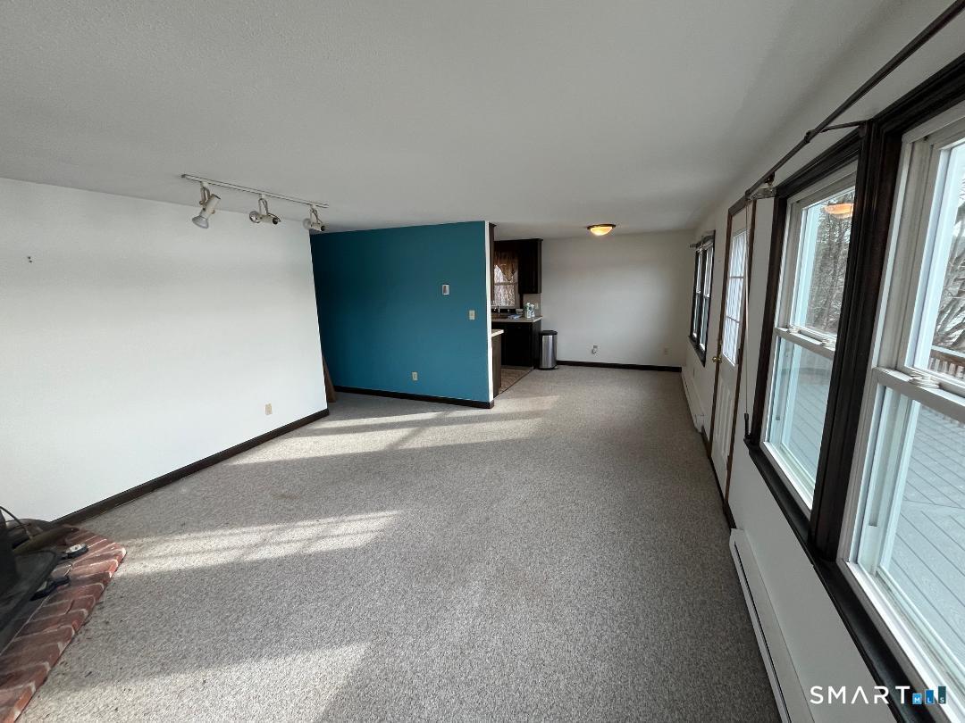 71 Ellington Road Tolland, CT 06084 - Photo 19 of 25 Living Room to Dining Room