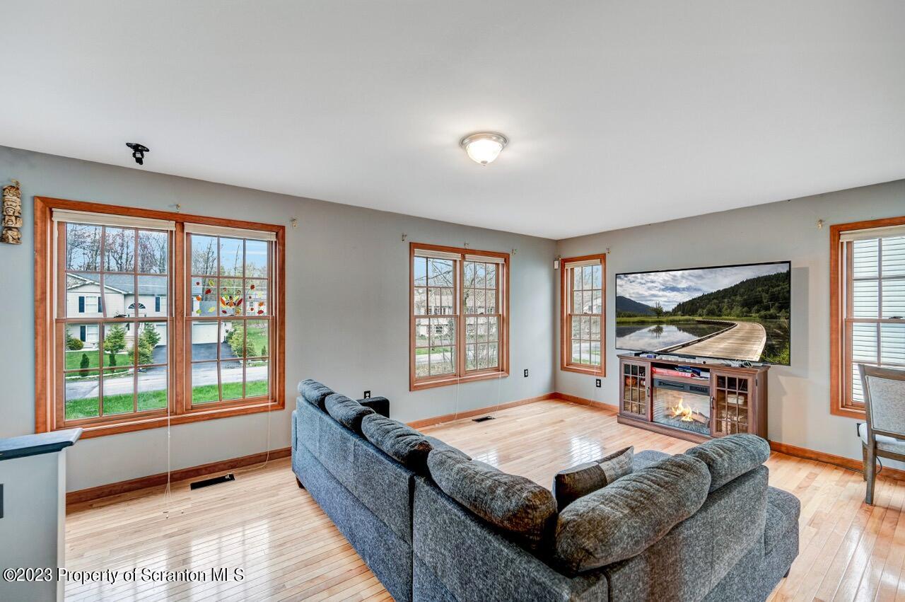 4156 Romeo Road Tobyhanna, PA 18466 - Photo 11 of 46 a living room with furniture and a window