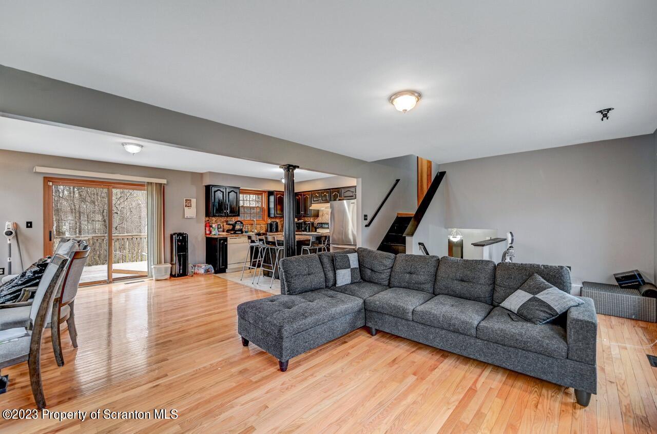 4156 Romeo Road Tobyhanna, PA 18466 - Photo 12 of 46 a living room with furniture and wooden floor