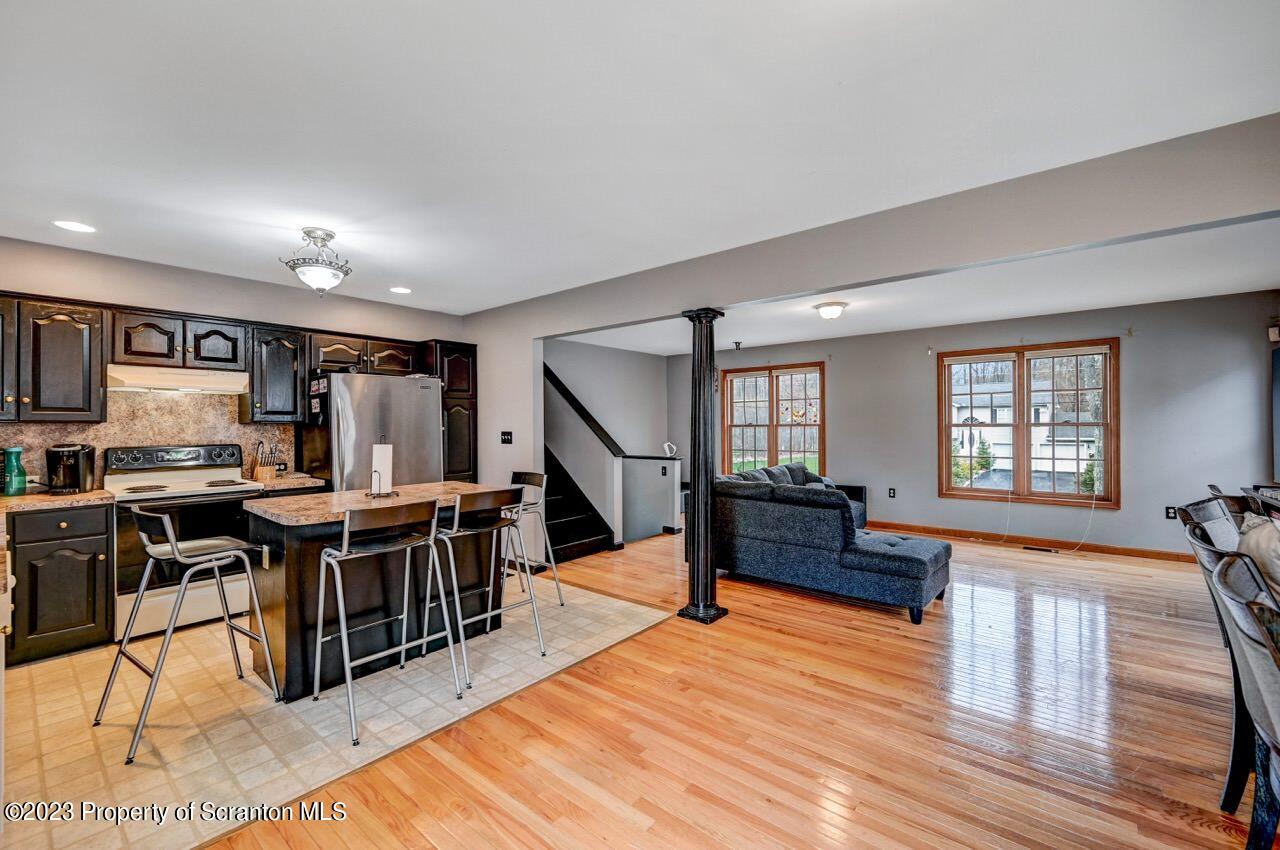 4156 Romeo Road Tobyhanna, PA 18466 - Photo 13 of 46 a living room with lots of furniture and a wooden floor