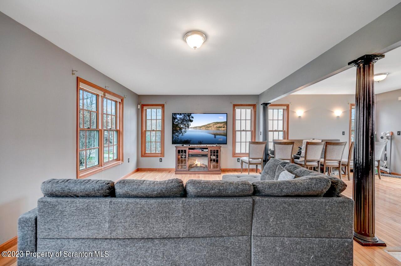 4156 Romeo Road Tobyhanna, PA 18466 - Photo 14 of 46 a living room with furniture and a flat screen tv