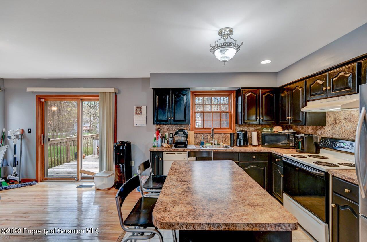 4156 Romeo Road Tobyhanna, PA 18466 - Photo 18 of 46 a living room with stainless steel appliances granite countertop furniture and a kitchen view