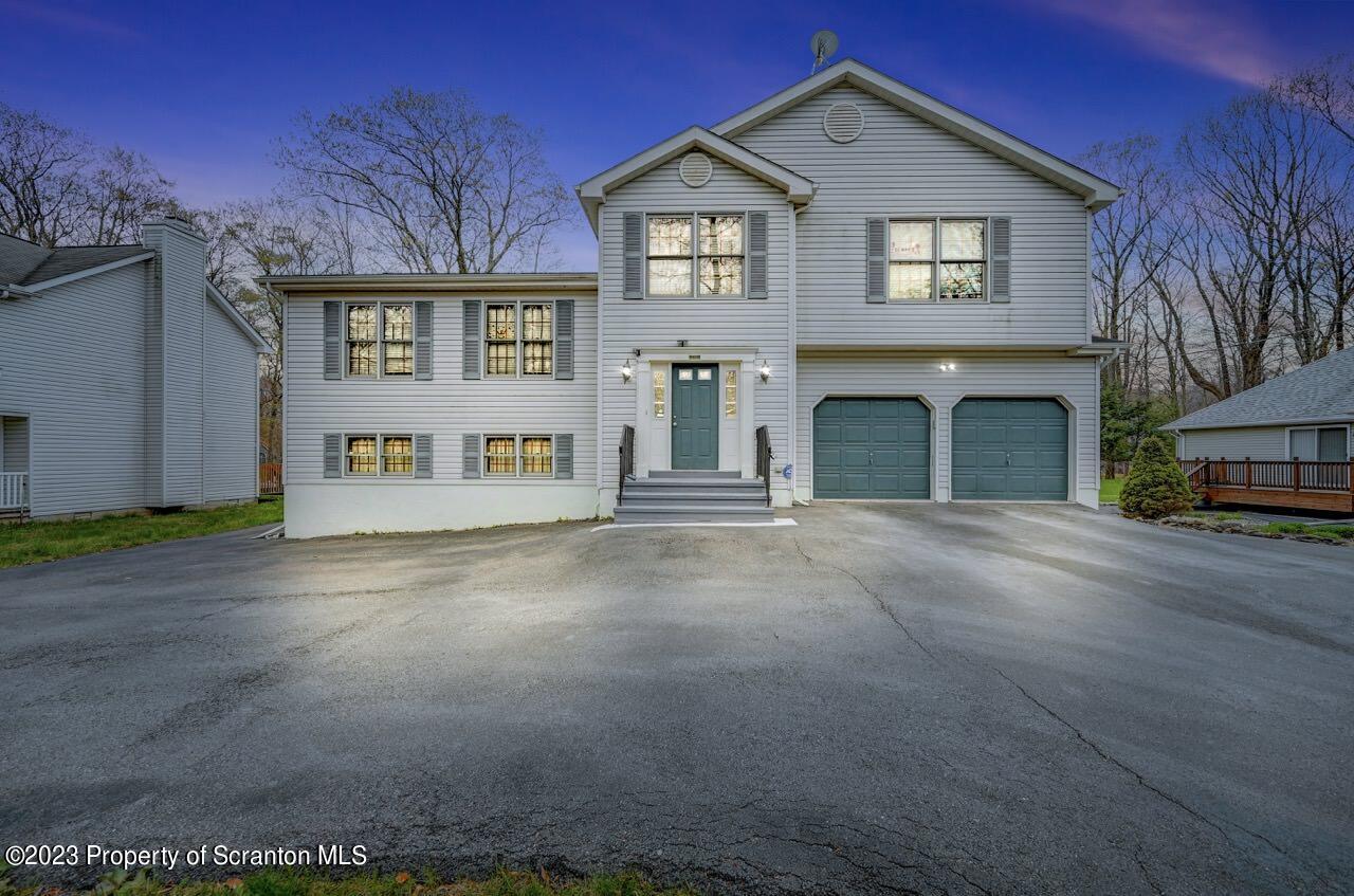 4156 Romeo Road Tobyhanna, PA 18466 - Photo 2 of 46 a view of a brick house with many windows
