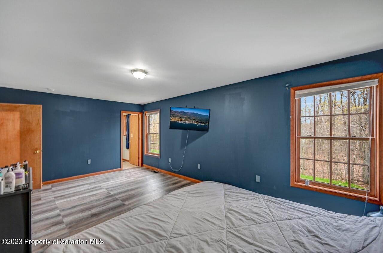 4156 Romeo Road Tobyhanna, PA 18466 - Photo 27 of 46 a bedroom with a bed and a window