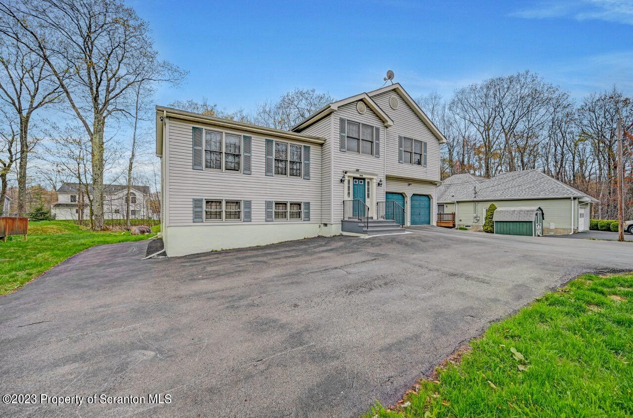 4156 Romeo Road Tobyhanna, PA 18466 - Photo 3 of 46 a view of house with yard and large trees