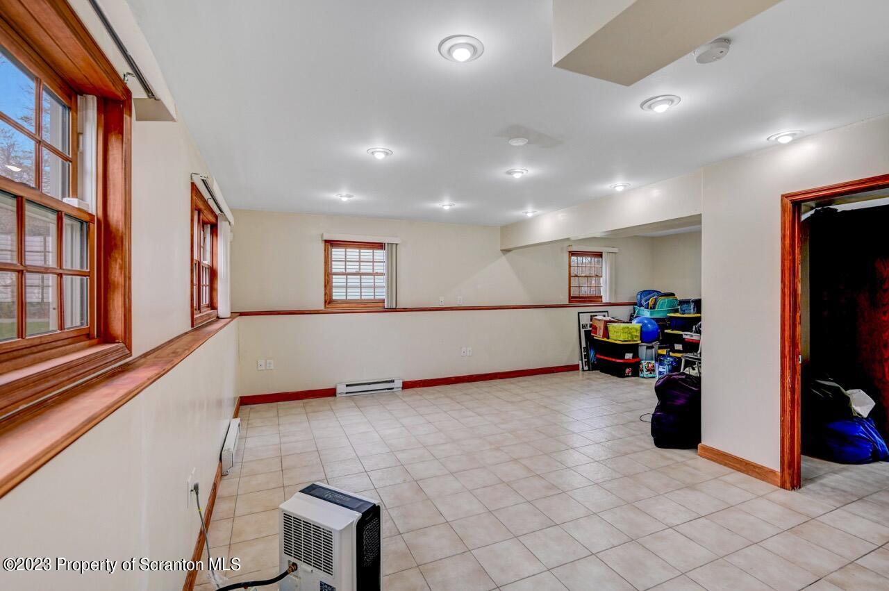 4156 Romeo Road Tobyhanna, PA 18466 - Photo 34 of 46 a view of a room with gym equipment and a large window