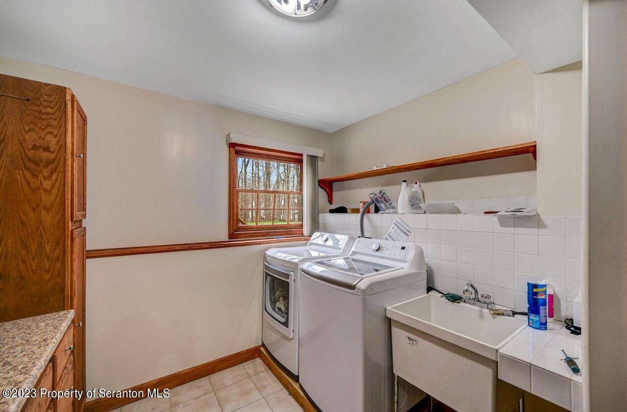 4156 Romeo Road Tobyhanna, PA 18466 - Photo 36 of 46 a utility room with dryer and washer