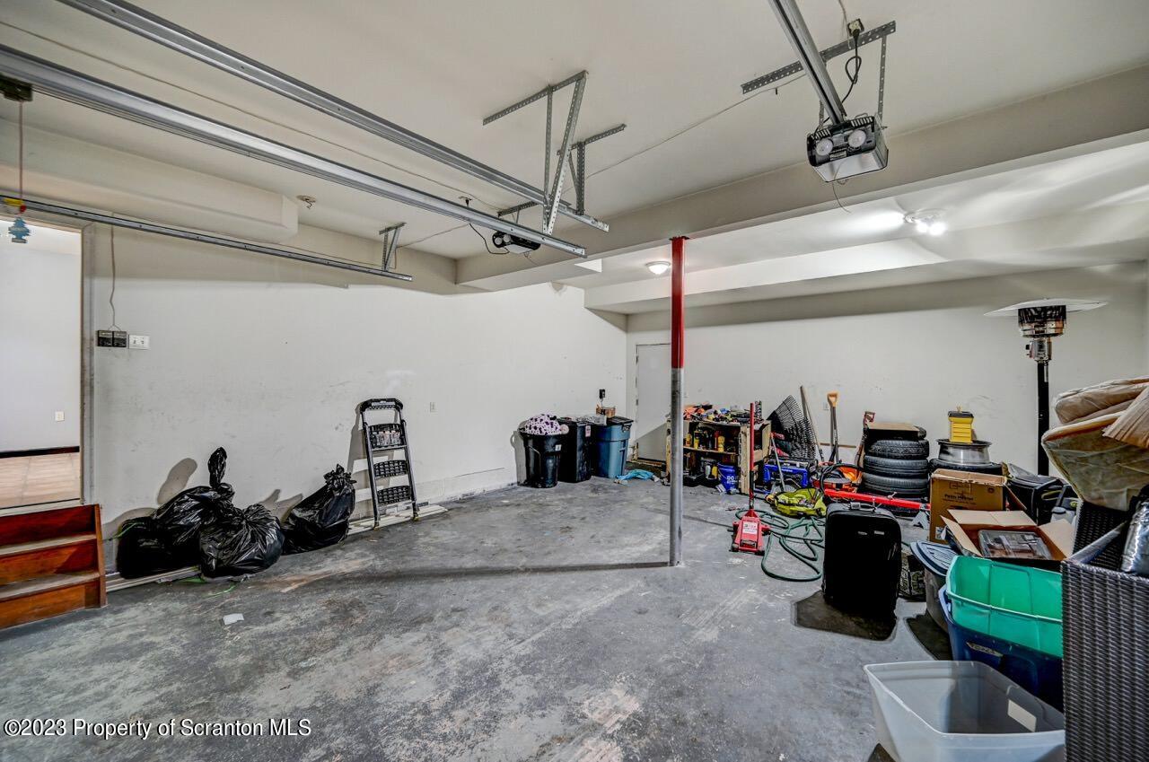 4156 Romeo Road Tobyhanna, PA 18466 - Photo 37 of 46 a view of a garage with a bike and white walls